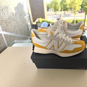 New Balance 327 'Primary Pack - Yellow and white' sneakers.